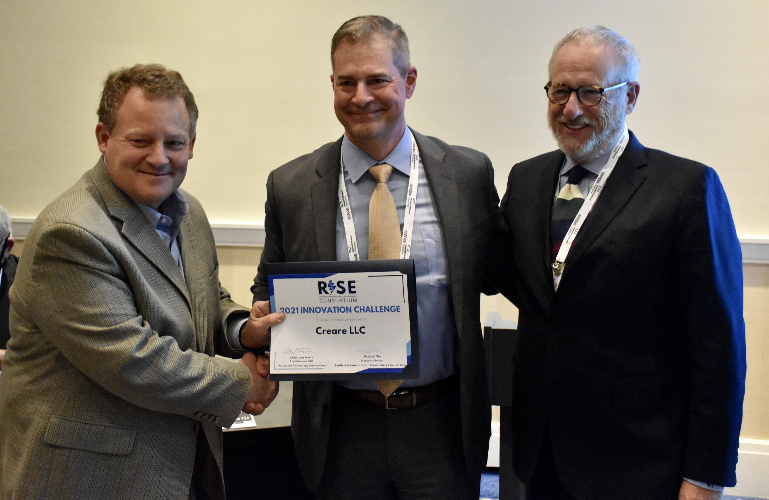 Chris Van Metre (L), ATI President and CEO, awarded Creare LLC reps photo